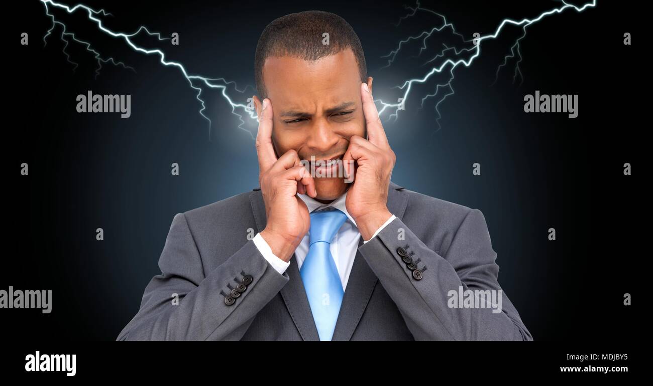 Lightning strikes and stressed man with headache holding head Stock Photo