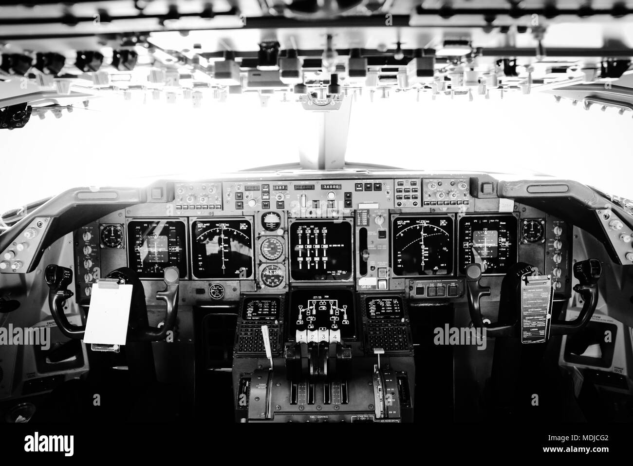 Black and White Photograph of the Flight Deck of a Jumbo Jet in Flight Stock Photo