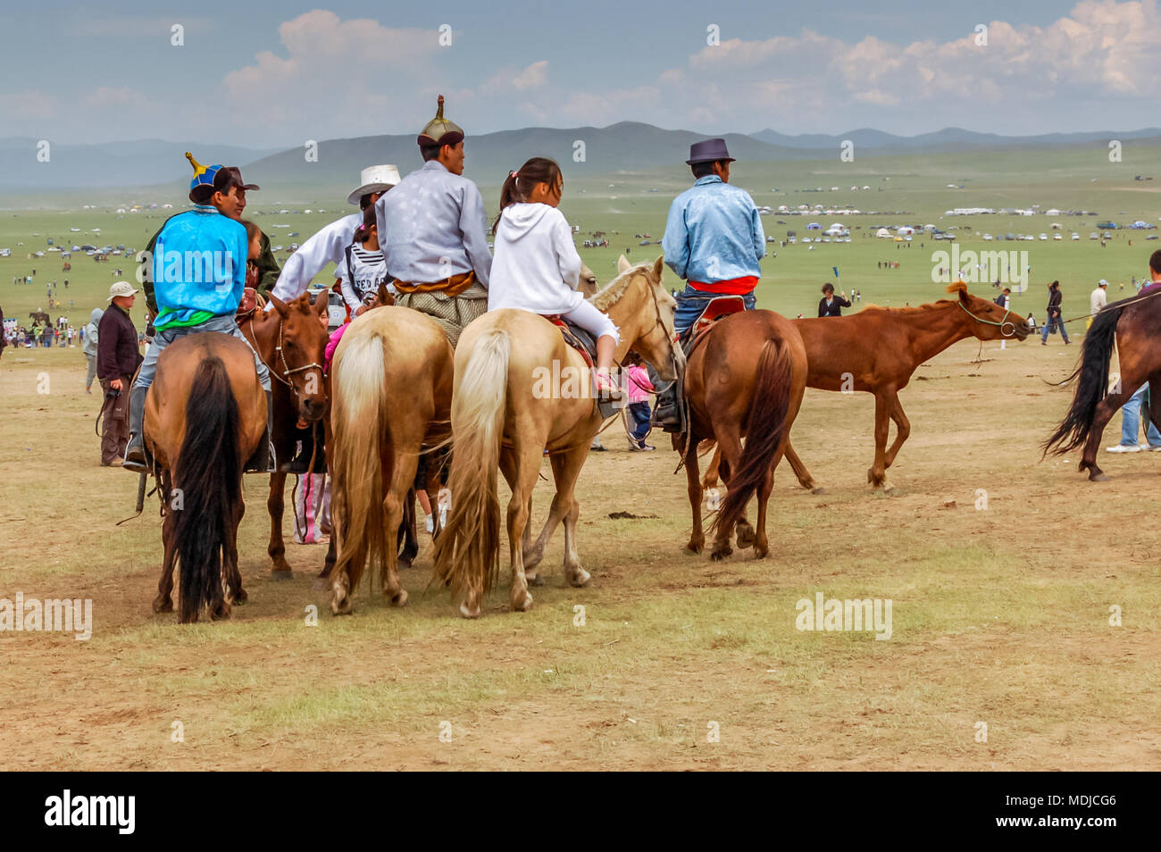 Khui Doloon Khudag, Mongolia - July 12, 2010:  Horseback Mongolians at Nadaam horse race on steppe outside Ulaanbaatar. Stock Photo