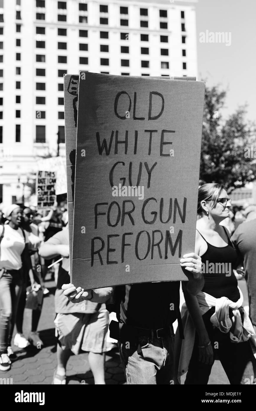 Old white gun for gun reform protest sign hires stock photography and