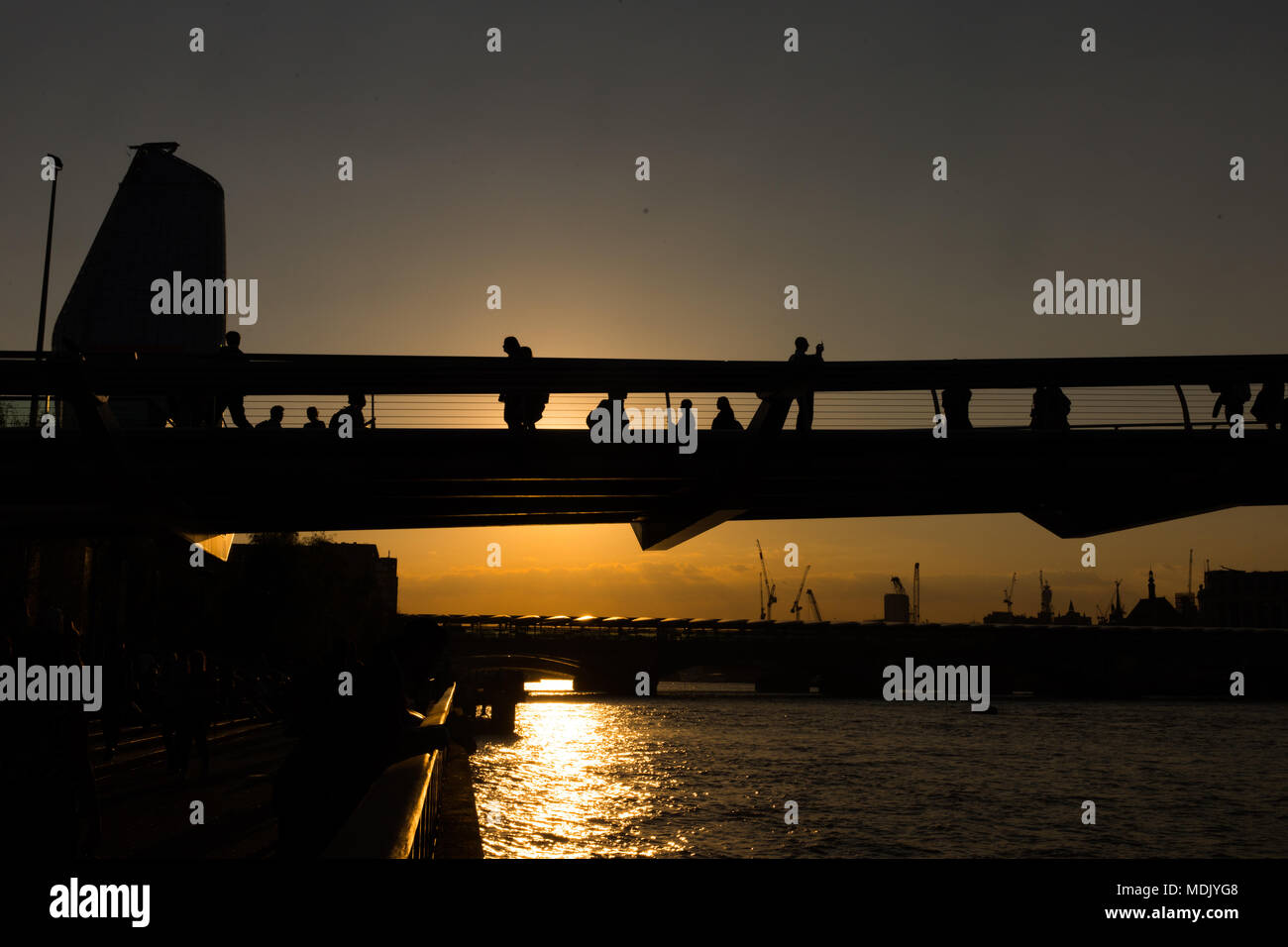 London, UK. 19th April, 2018. UK Weather: Beautiful sunset over the River Thames, with Millennium Bridge in silhouette in London, UK Credit: Carol MoirAlamy Live News Stock Photo Stock Photo