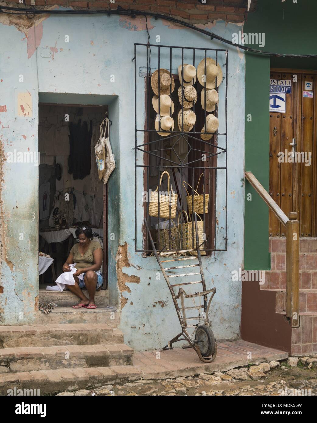 Trinidad, Cuba. 26th Nov, 2017. A tradeswoman is sitting at the