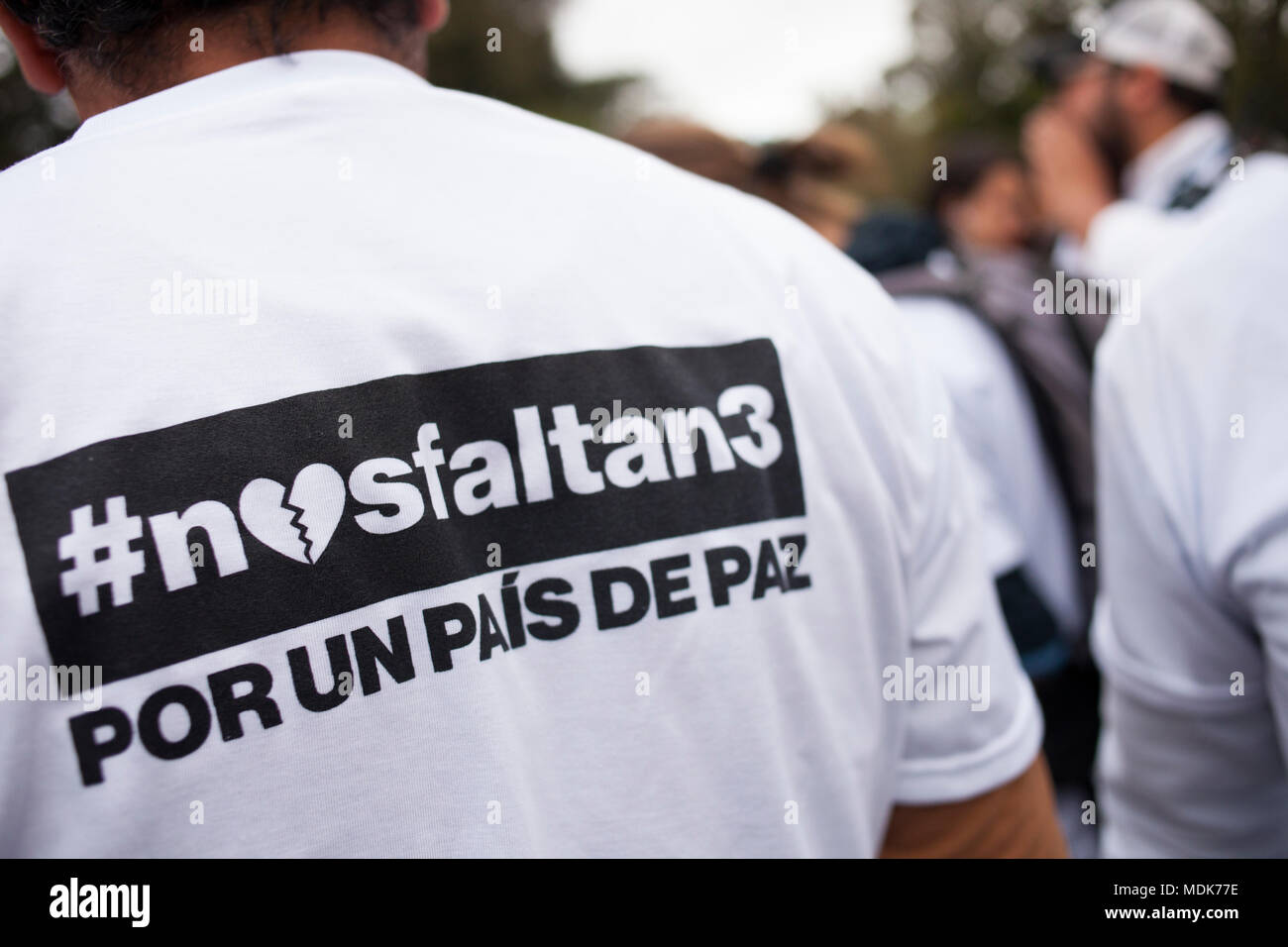 19 April 2018, Ecuador, Quito: A protestor wears a shirt reading '#nosfaltan3 Por un país de Paz' (lit. '#WeAreMissing3. For a country of peace!'). Numerous people have gathered to protest the kidnapping and murder of two journalists working for the newspaper 'El Comercio' and their driver on the border region between Ecuador and Colombia. Photo: Santiago Serrano/dpa Stock Photo