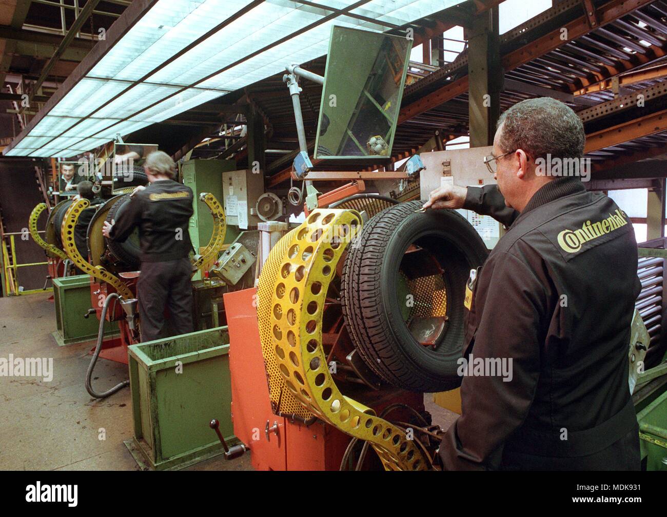 staff at quality control station going through each finished tire. Taken on June 8, 1994. | usage worldwide Stock Photo