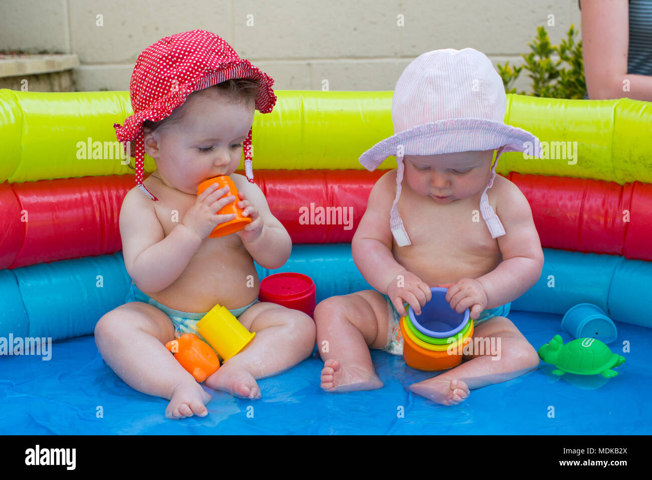 Babies in a paddling pool Stock Photo Alamy