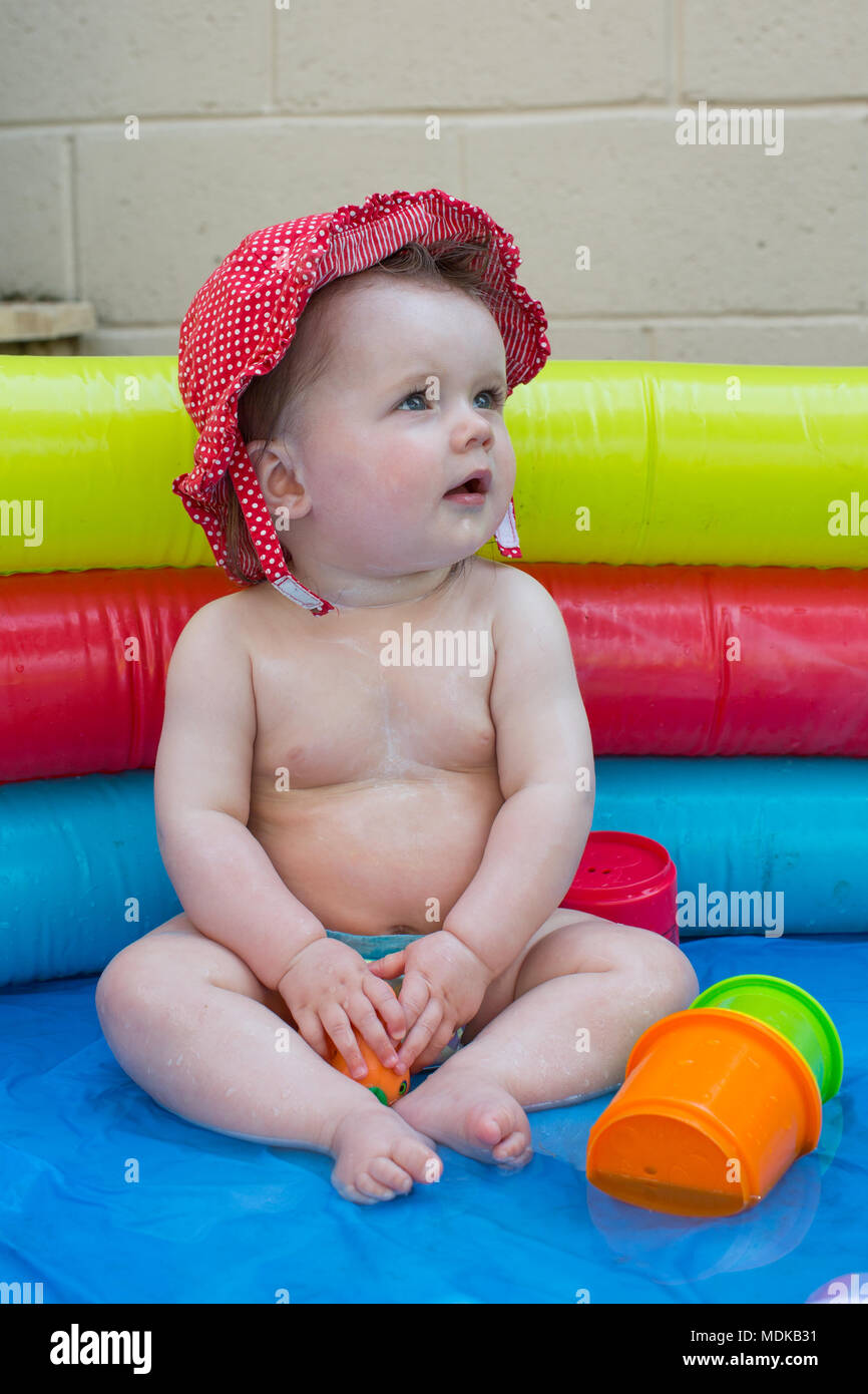 Babies in a paddling pool Stock Photo Alamy
