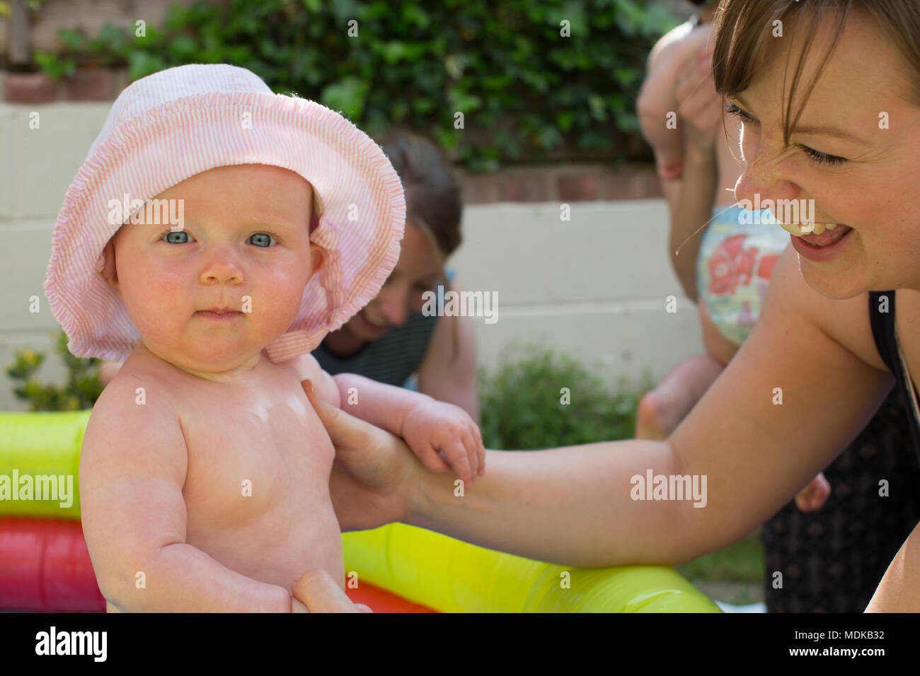 Babies in a paddling pool Stock Photo Alamy