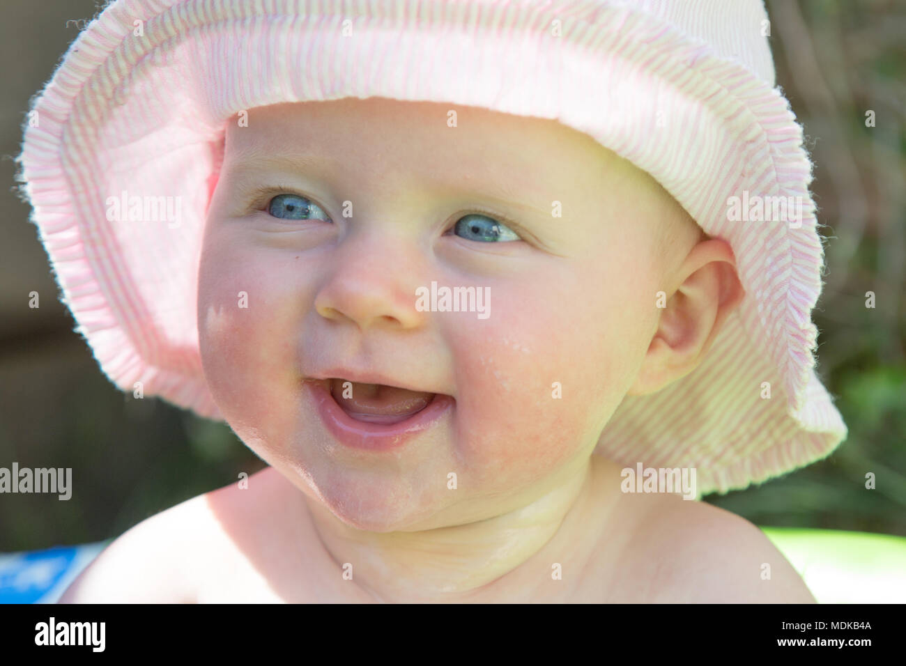 Baby wearing a sun hat Stock Photo Alamy