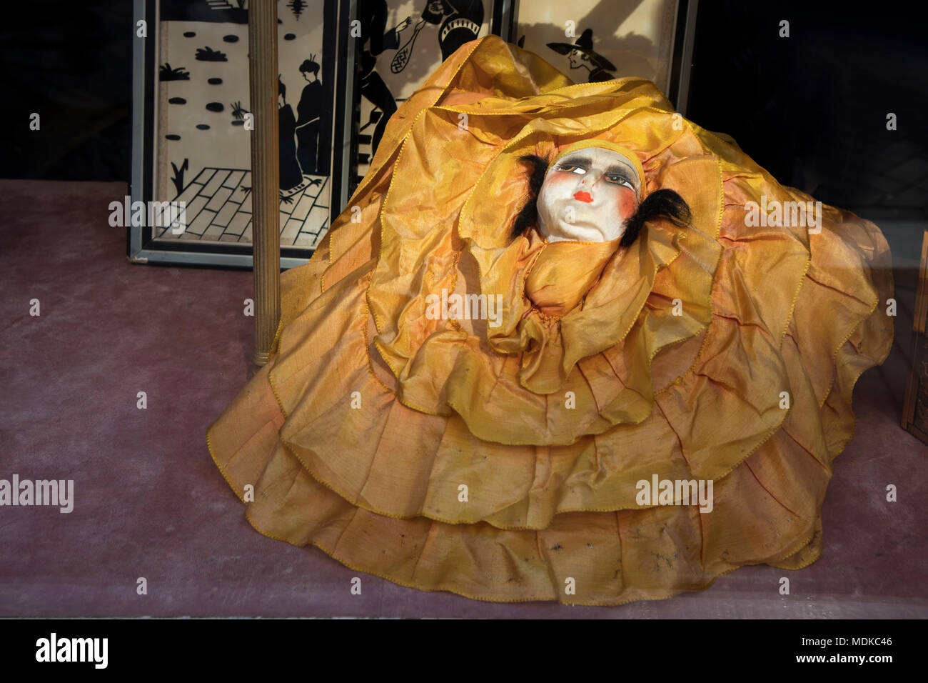 Amsterdam, Holland 14 April 2018 Ancient doll Pierrot in the window
