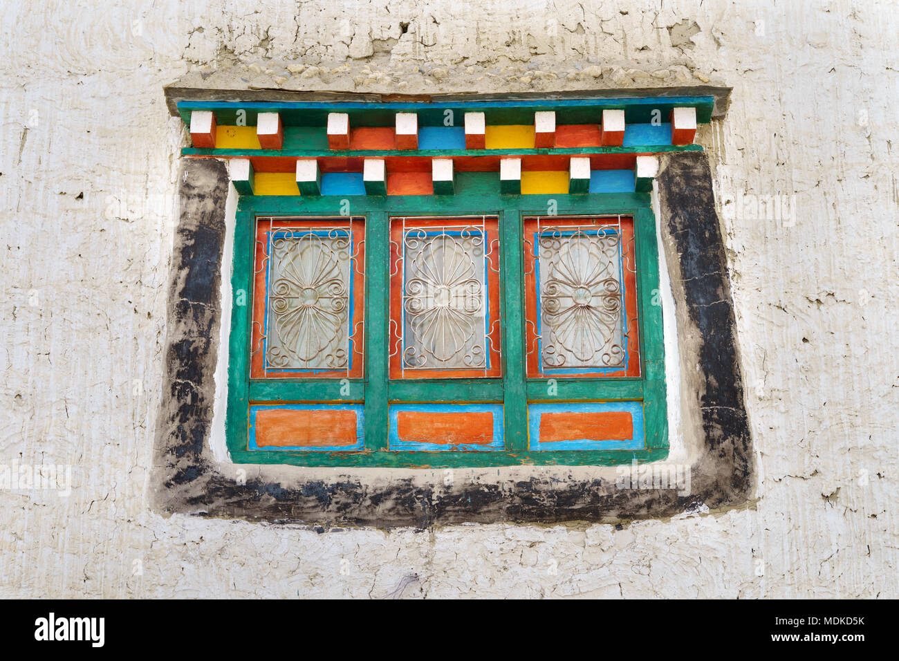 Colourful  window on a Tibetan style house, Upper Mustang region, Nepal. Stock Photo