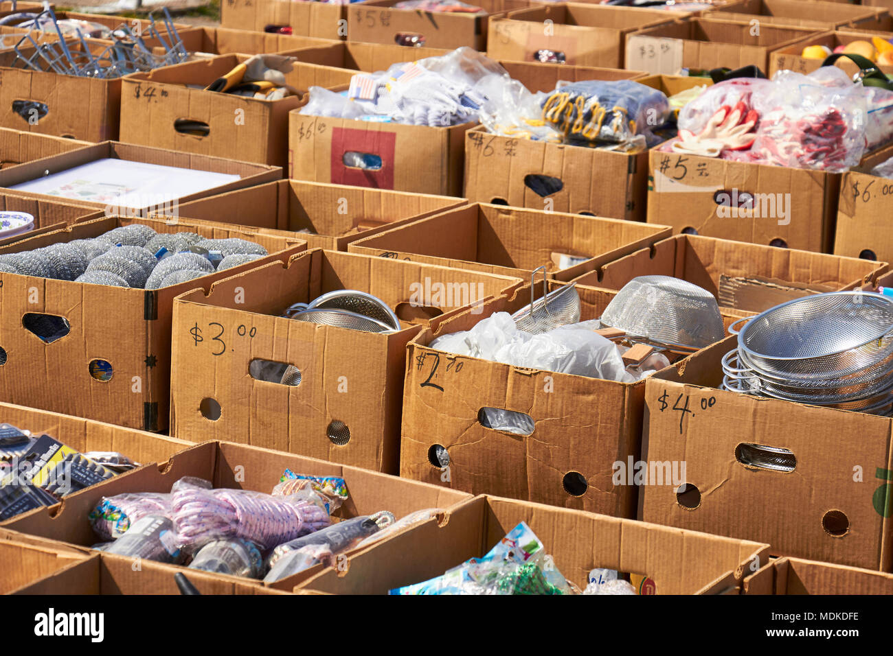 Boxes of goods for sale at the Green Dragon Market, Amish Country,  Ephrata, Pennsylvania, USA Stock Photo