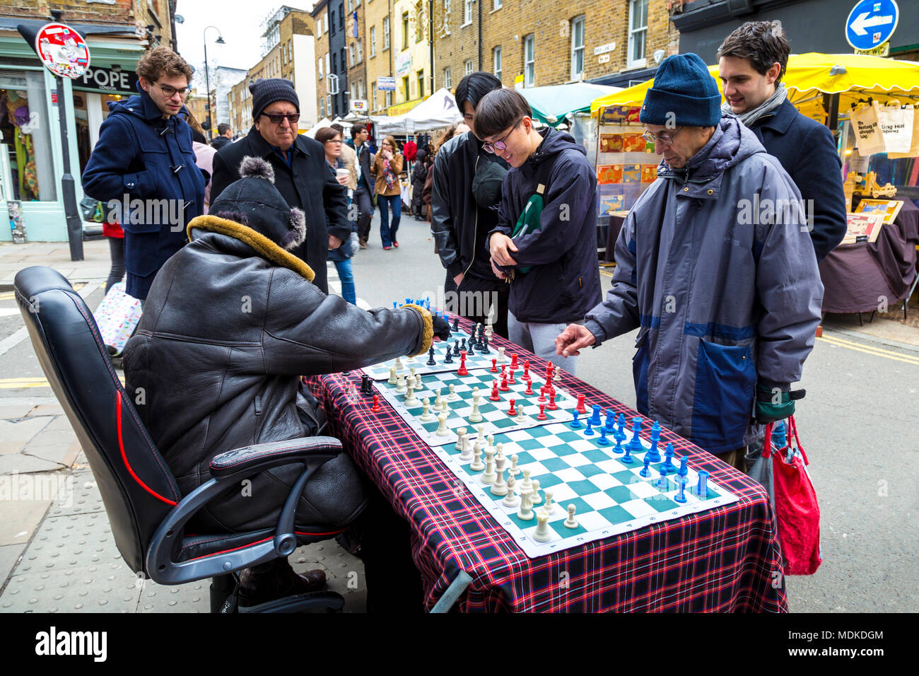 Brick Lane Chess Master playing 3 opponents, London, UK Stock Photo