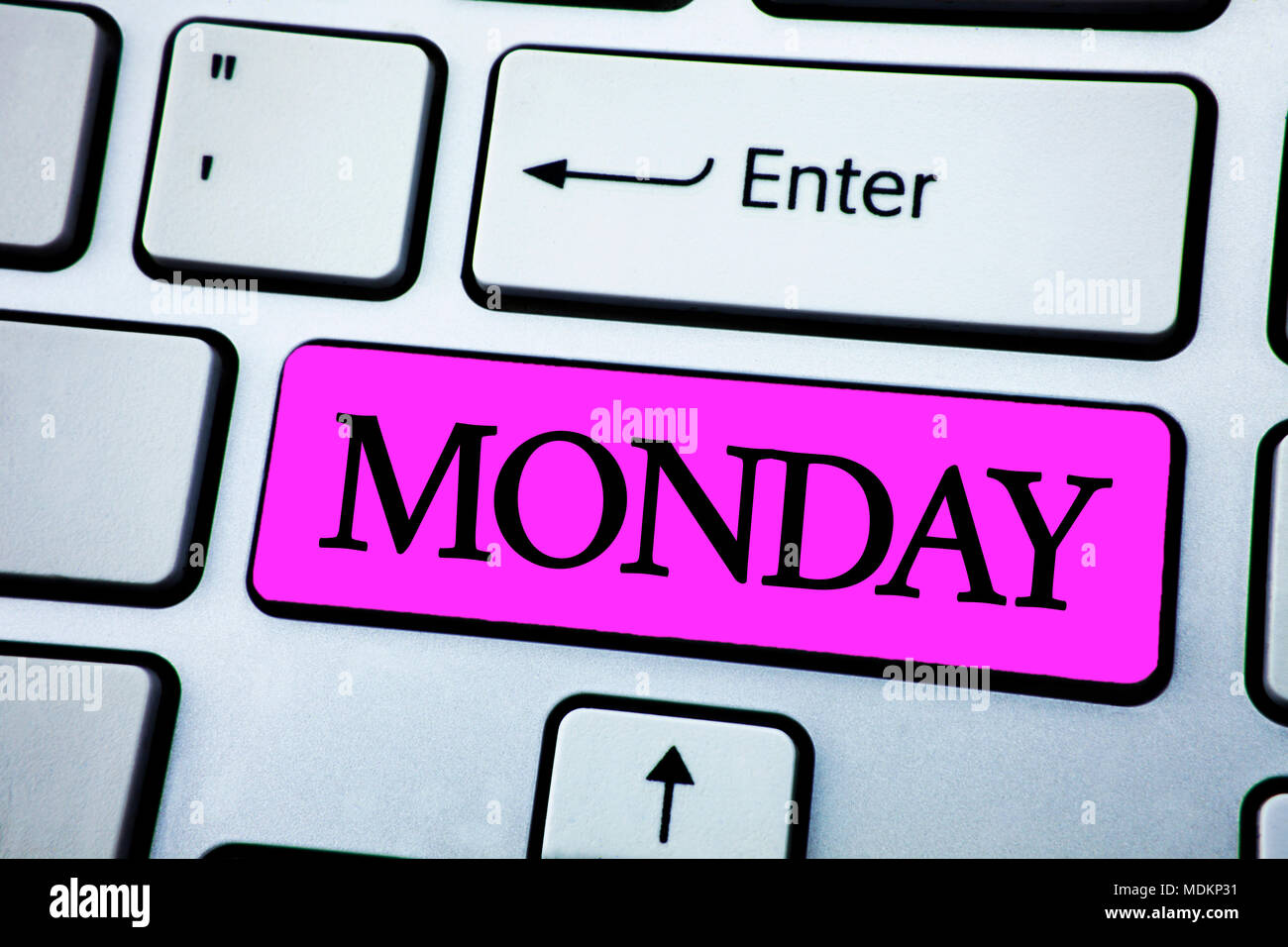 Text sign showing Monday. Conceptual photo First day of the week Back to work Weekend is over Wakeup Early written Pink Key Button White Keyboard with Stock Photo