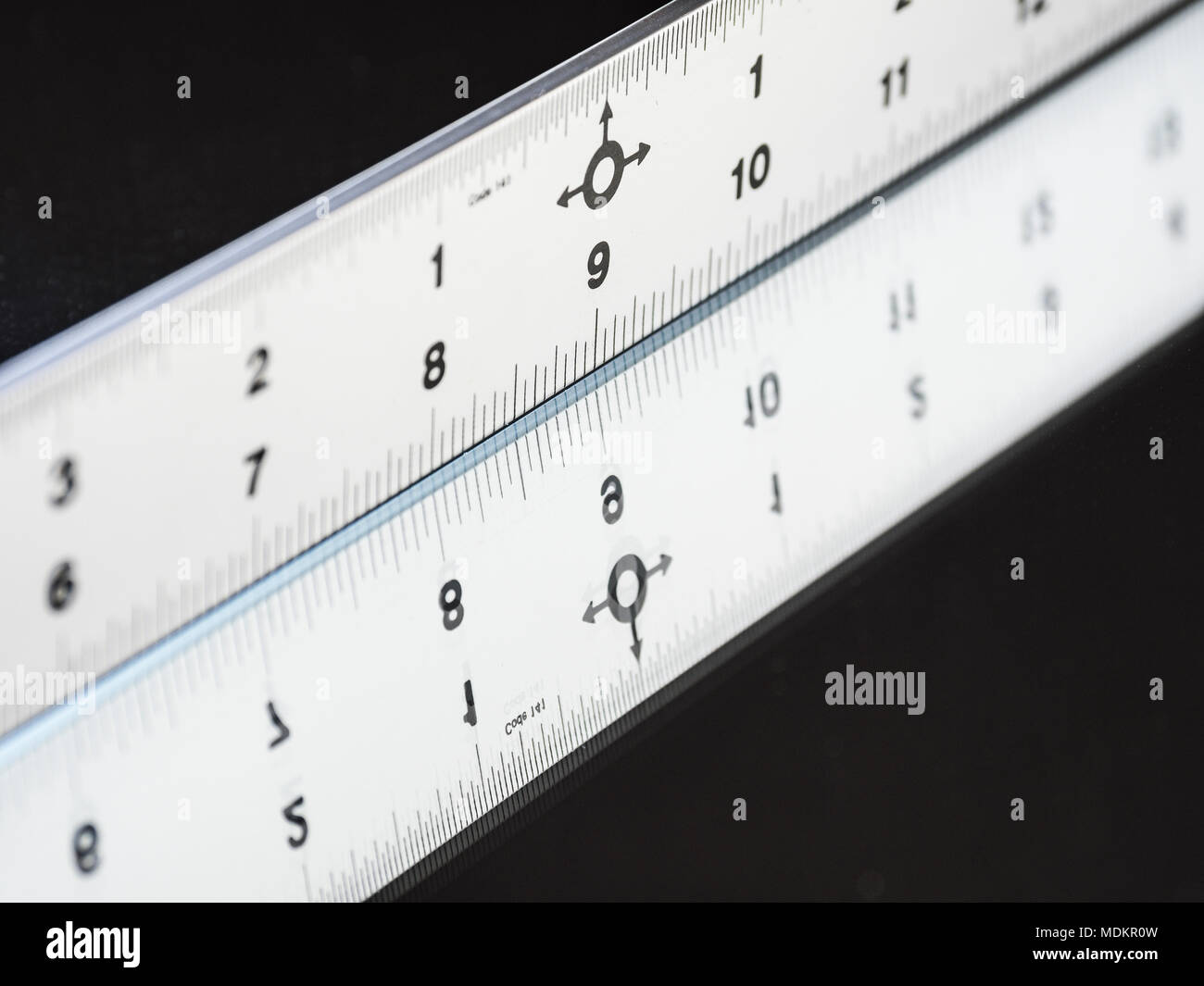 silver ruler tool on mirror Stock Photo - Alamy