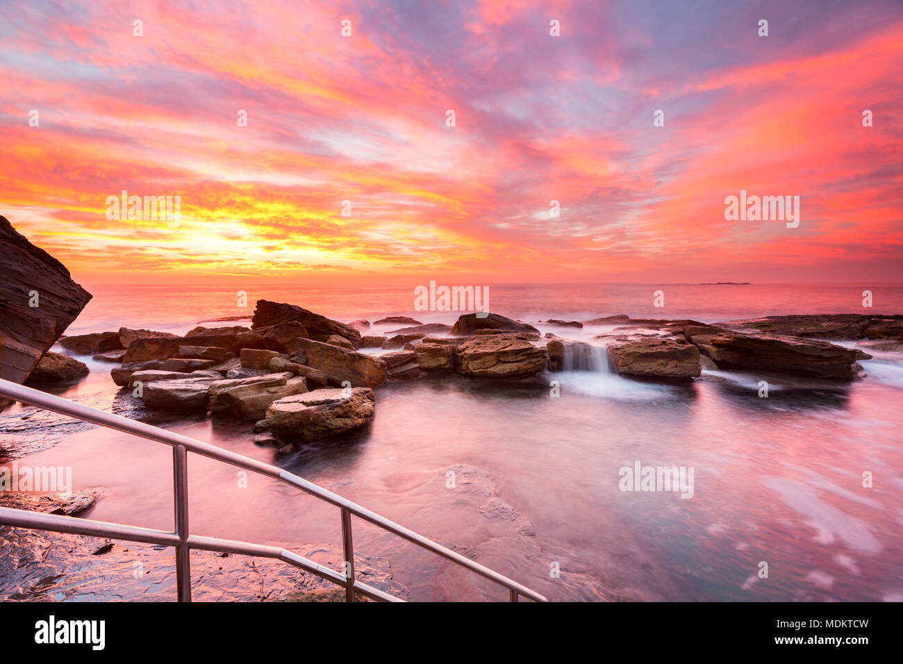 Sunrise with cascading water, Coogee Beach, Sydney, Australia Stock Photo