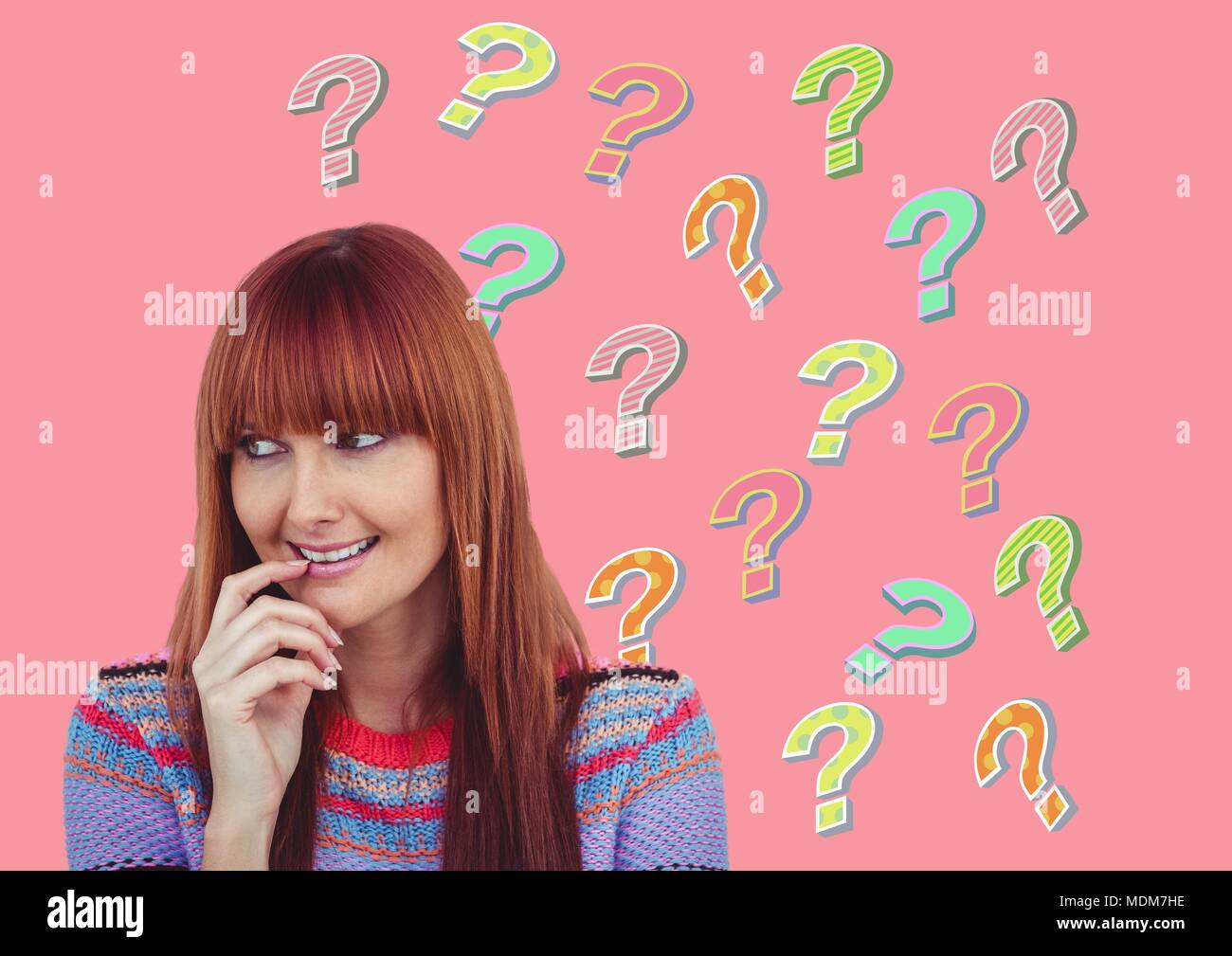 Woman thinking with colorful funky question marks Stock Photo