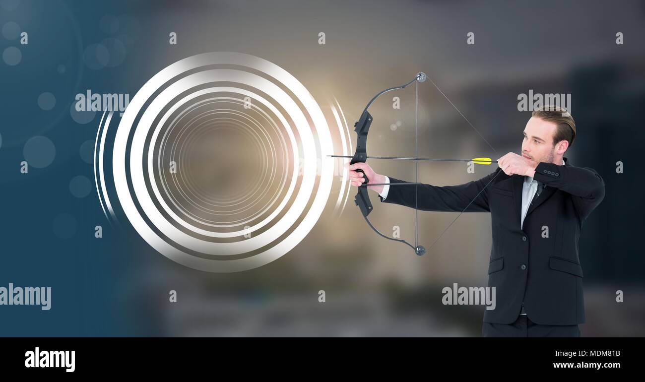 Archer man with bow and arrow and Glowing circle technology interface Stock Photo