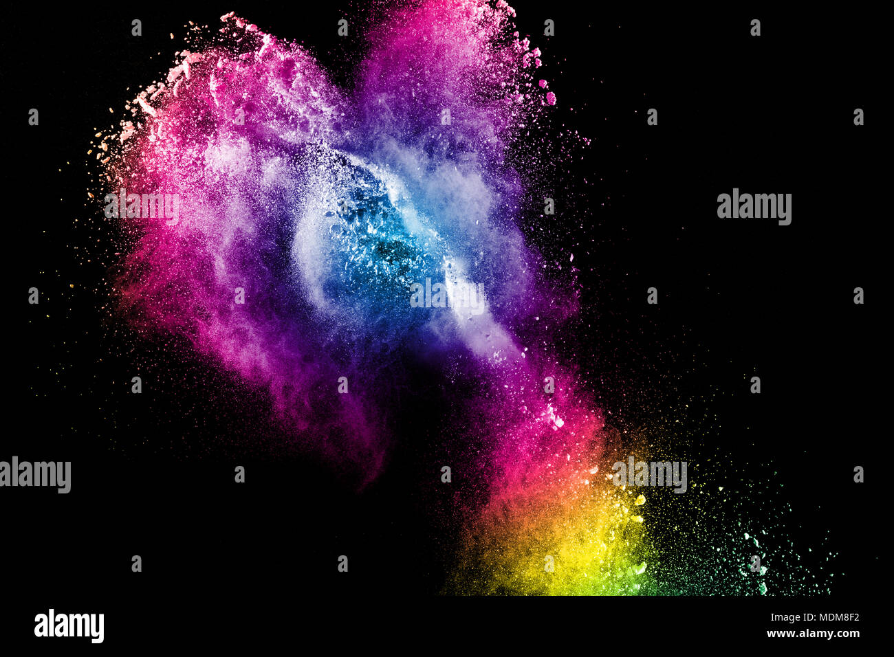 Multi color powder explosion isolated on black background. Stock Photo