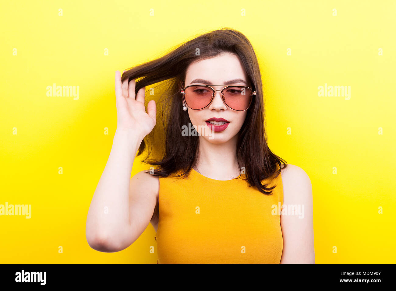 Gorgeous woman wearing sunglasses laughing Stock Photo - Alamy