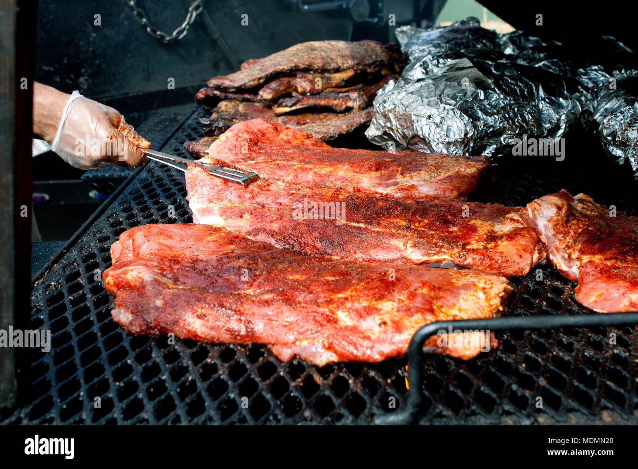 Slabs of ribs cook on grill at barbeque festival Stock Photo - Alamy