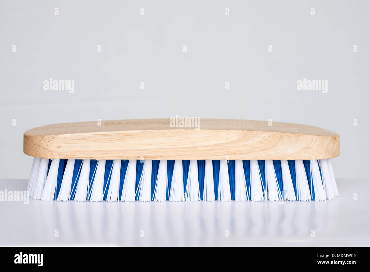 Wood brush for cleaning house on white background Stock Photo - Alamy