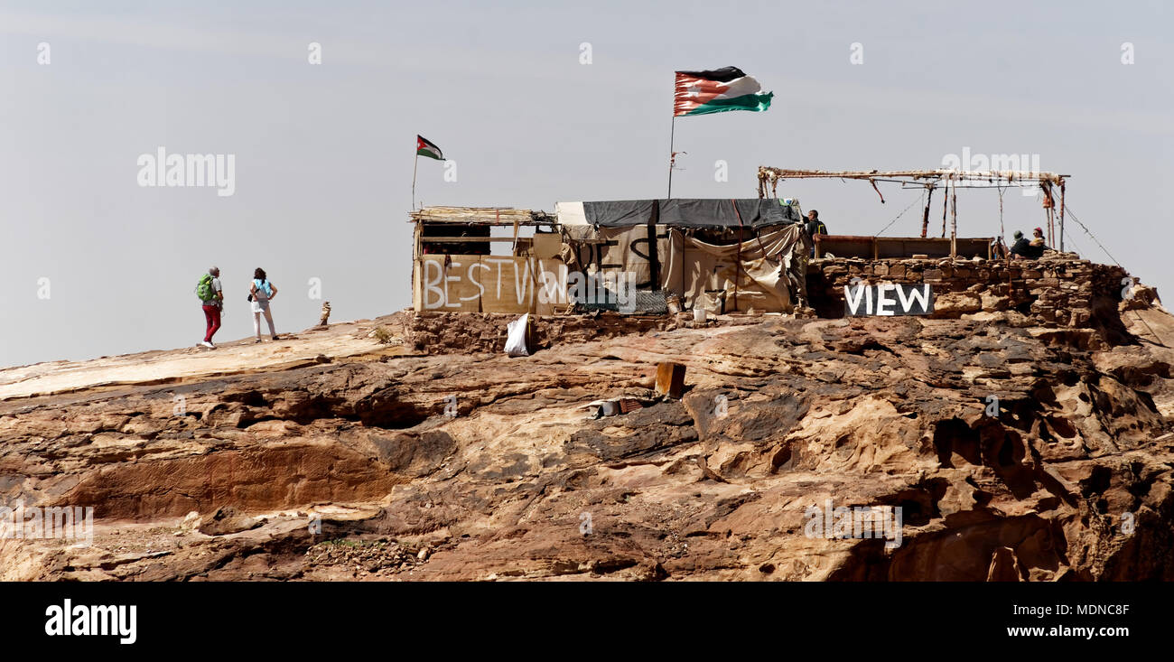 Petra, Wadi Musa, Jordan, March 9, 2018: A viewpoint with a small hut where tourists can buy tea and water on the rocks of Petra behind Al-Deir Monast Stock Photo