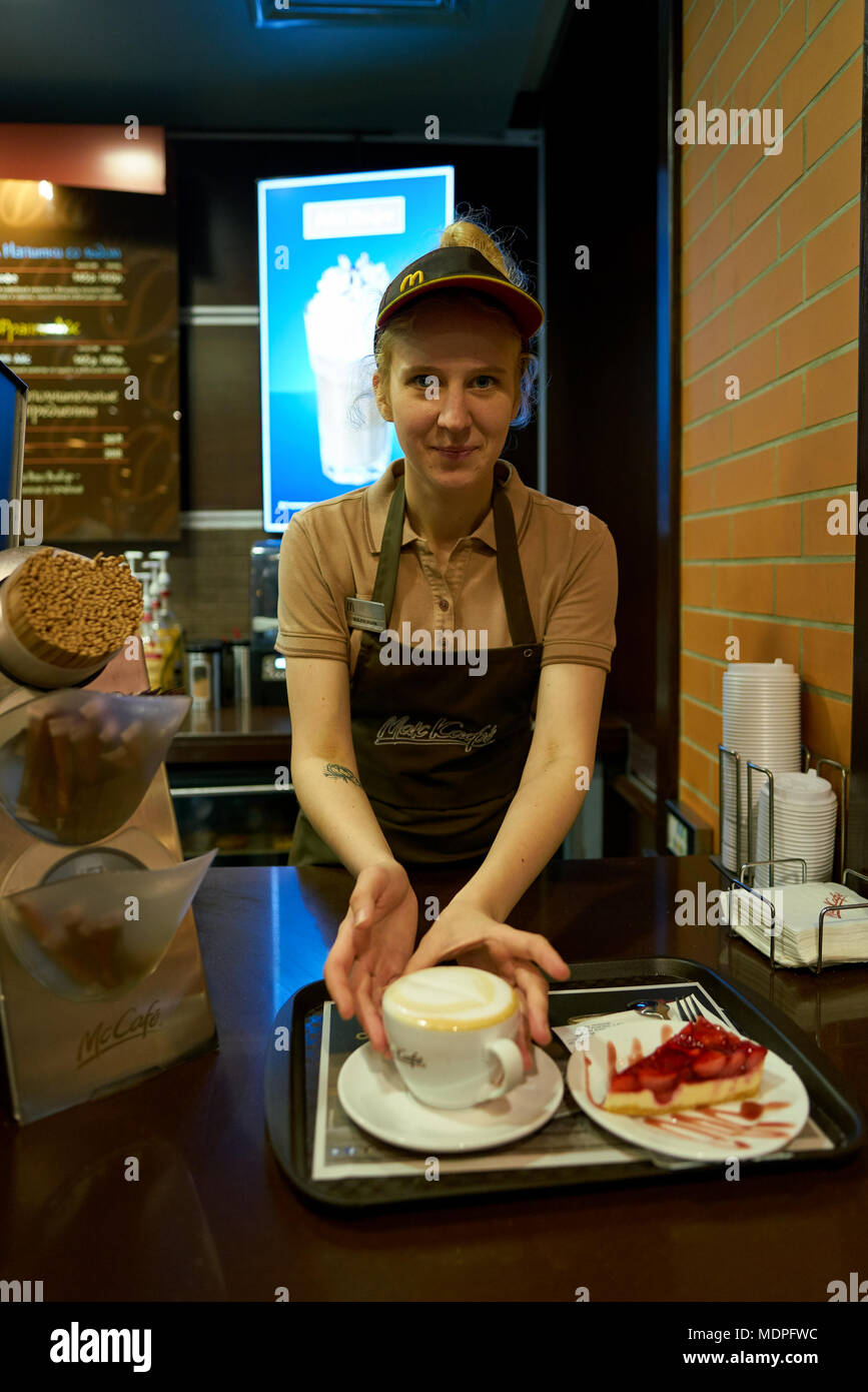 Mccafe Worker SAINT PETERSBURG, RUSSIA - CIRCA OCTOBER, 2017: worker at a McCafe ...