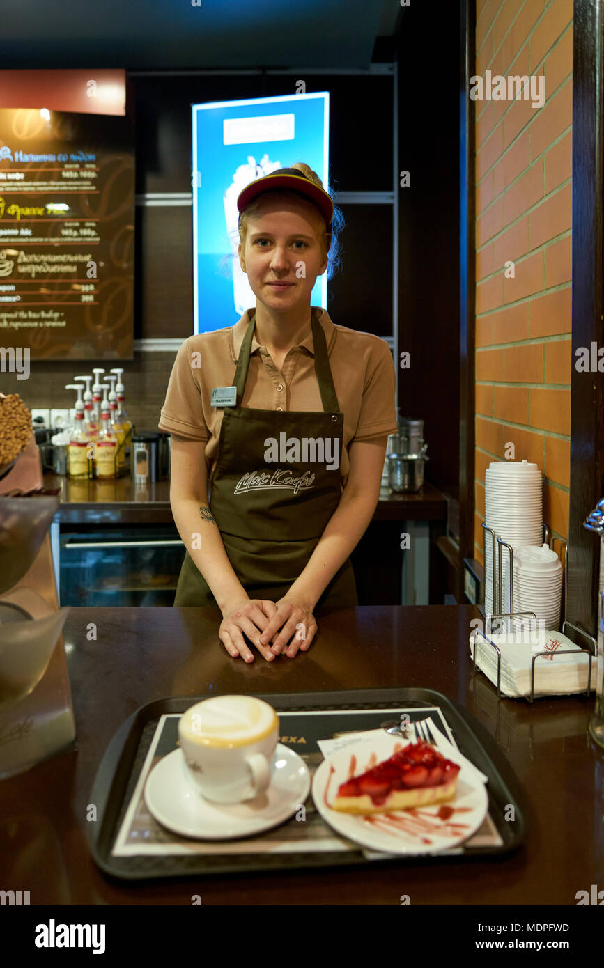 Mccafe Worker SAINT PETERSBURG, RUSSIA - CIRCA OCTOBER, 2017: worker at a McCafe ...