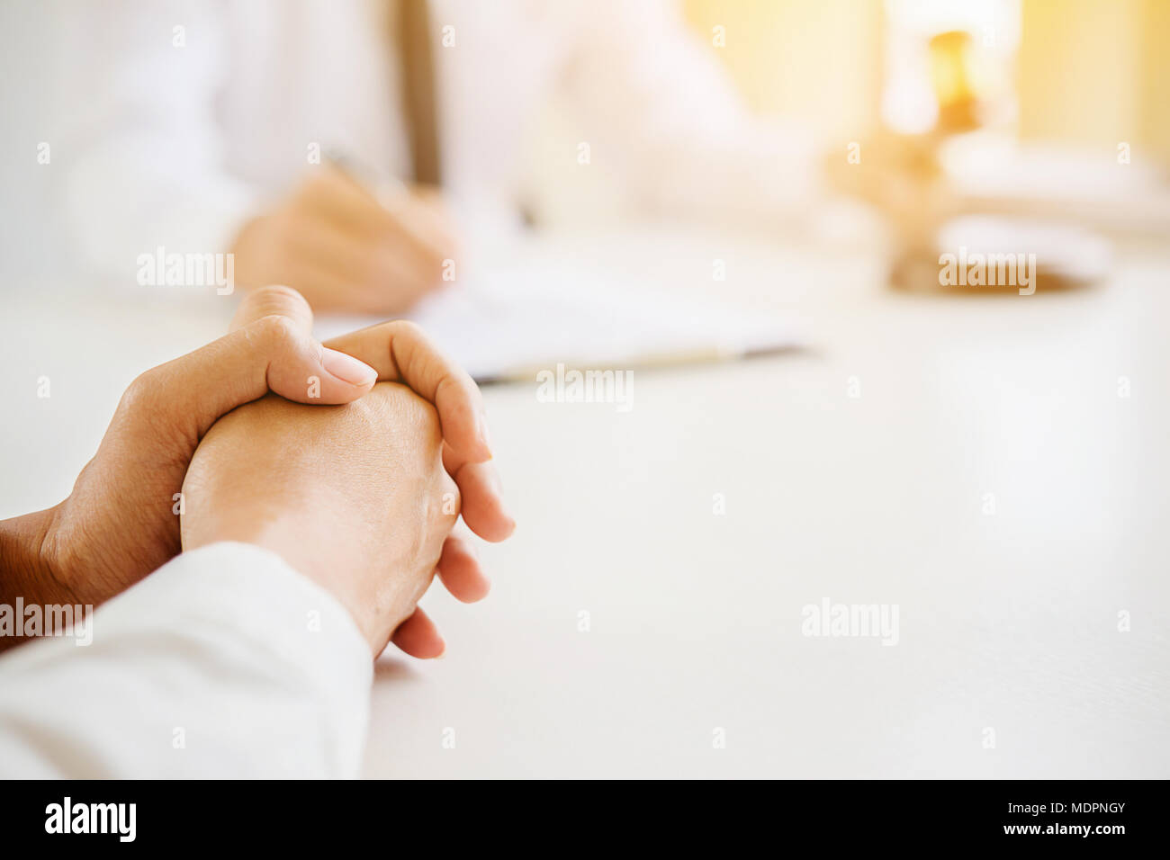 Justice and Law concept. Legal counsel presents to the client a signed contract with gavel and legal law or legal having team meeting at law firm in b Stock Photo