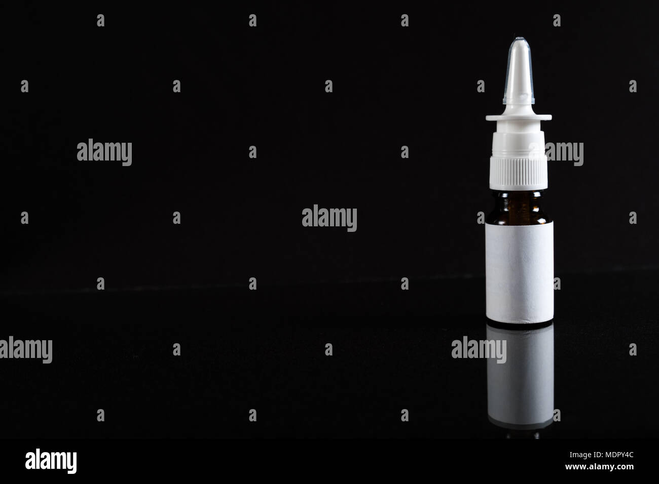 nasal-spray-in-isolated-on-black-concept-pharmacy-with-copy-space-MDPY4C.jpg