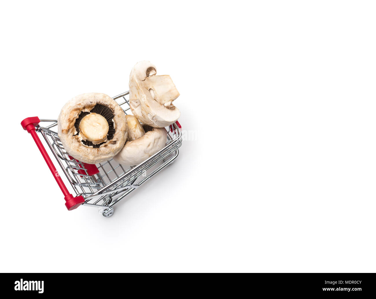 Buying a mushroom from supermarket Mushroom harvest, white mushrooms Stock Photo