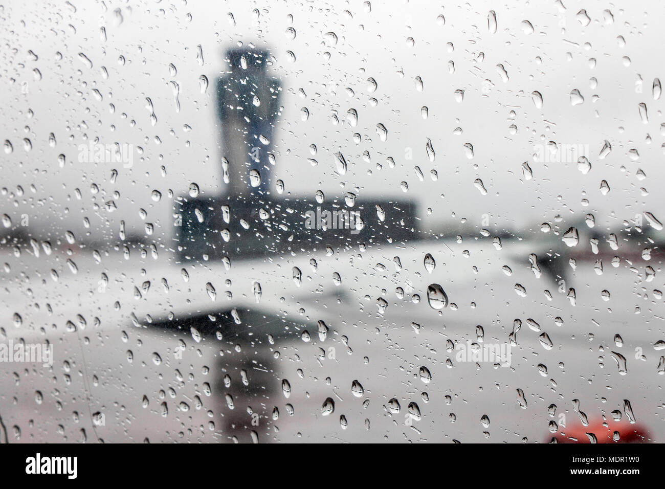 Views of the Santiago de Compostela - Lavacolla Airport air traffic control tower on a rainy day, through an aircraft window covered with raindrops Stock Photo