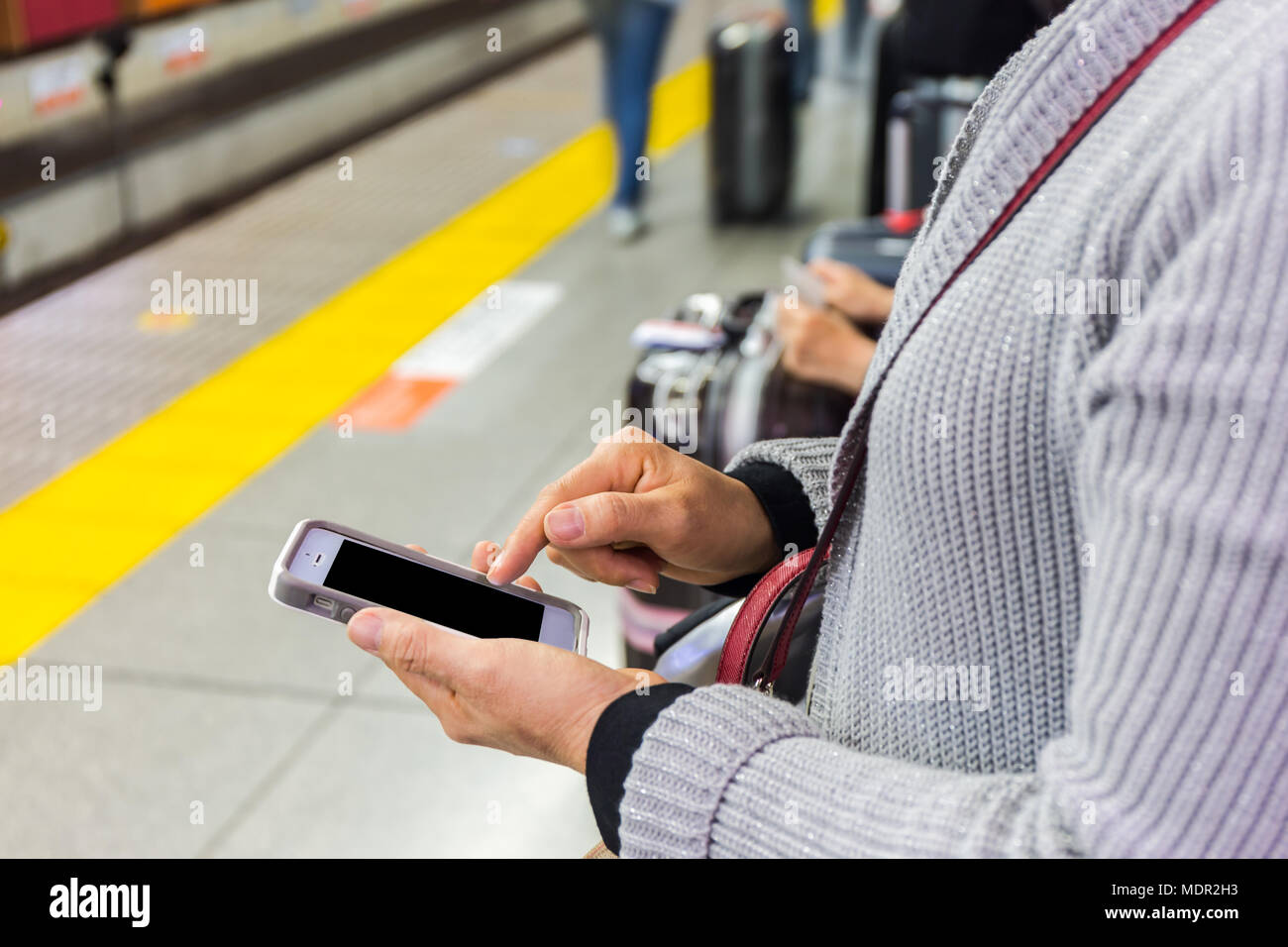 Wmata Using Phone Woman using cell phone in the subway hi-res stock photography and ...