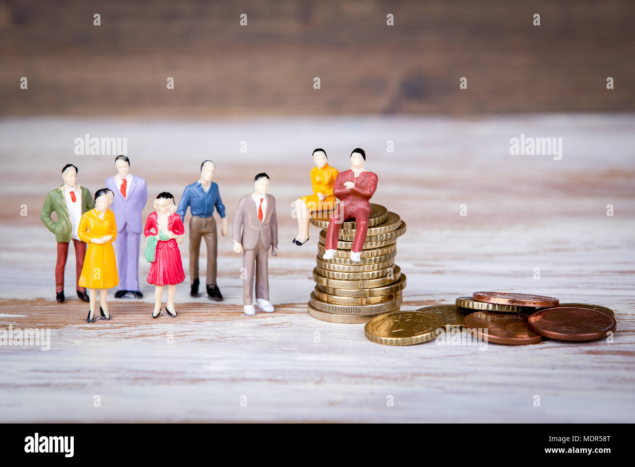 Making money, selling and competing. Colorful Human miniatures Stock