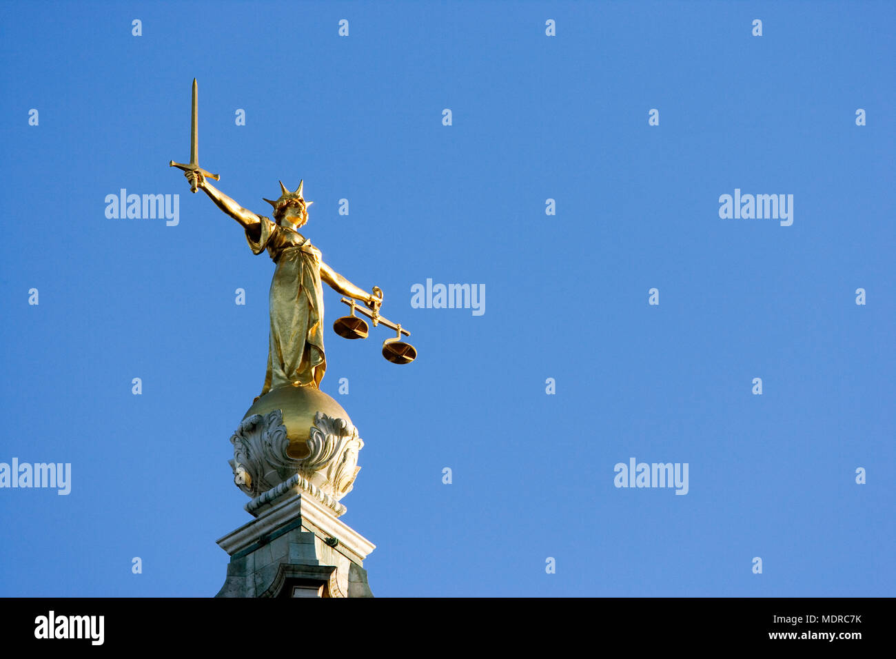 London, UK; statue of Justice on top of the London Criminal Court (Old