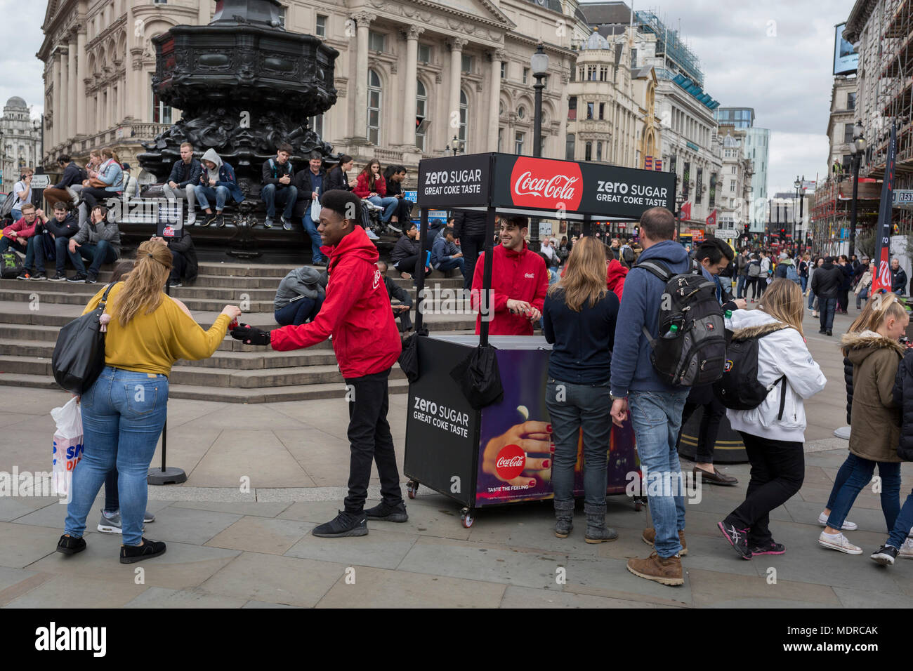 Marketing workers with Coca-Cola hand out samples of their new Zero Sugar (Sugar Free) drinks to passers-by in Piccadilly Circus, on 16th April 2018, in London, England. Stock Photo