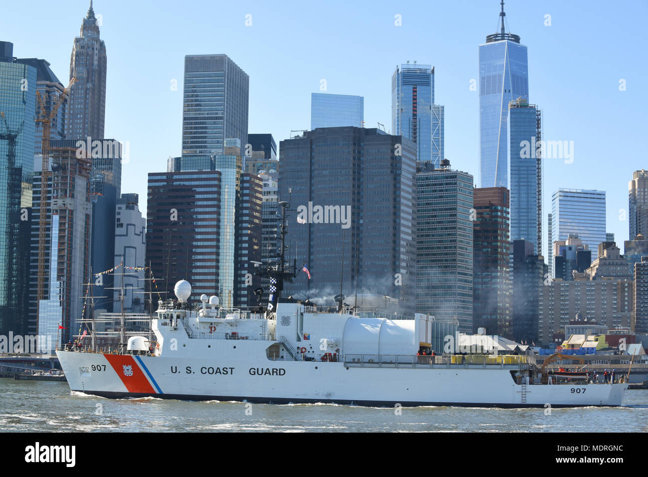 Coast Guard Cutter Escanaba, a 270-foot Medium Endurance Cutter homeported in Boston, Mass., transits southbound on the East River near Lower Manhattan in New York City, March 24, 2018. The Escanaba had just completed a several month dry dock at the Brooklyn Naval Yard. (U.S. Coast Guard photo by Petty Officer 3rd Class Steve Strohmaier) Stock Photo
