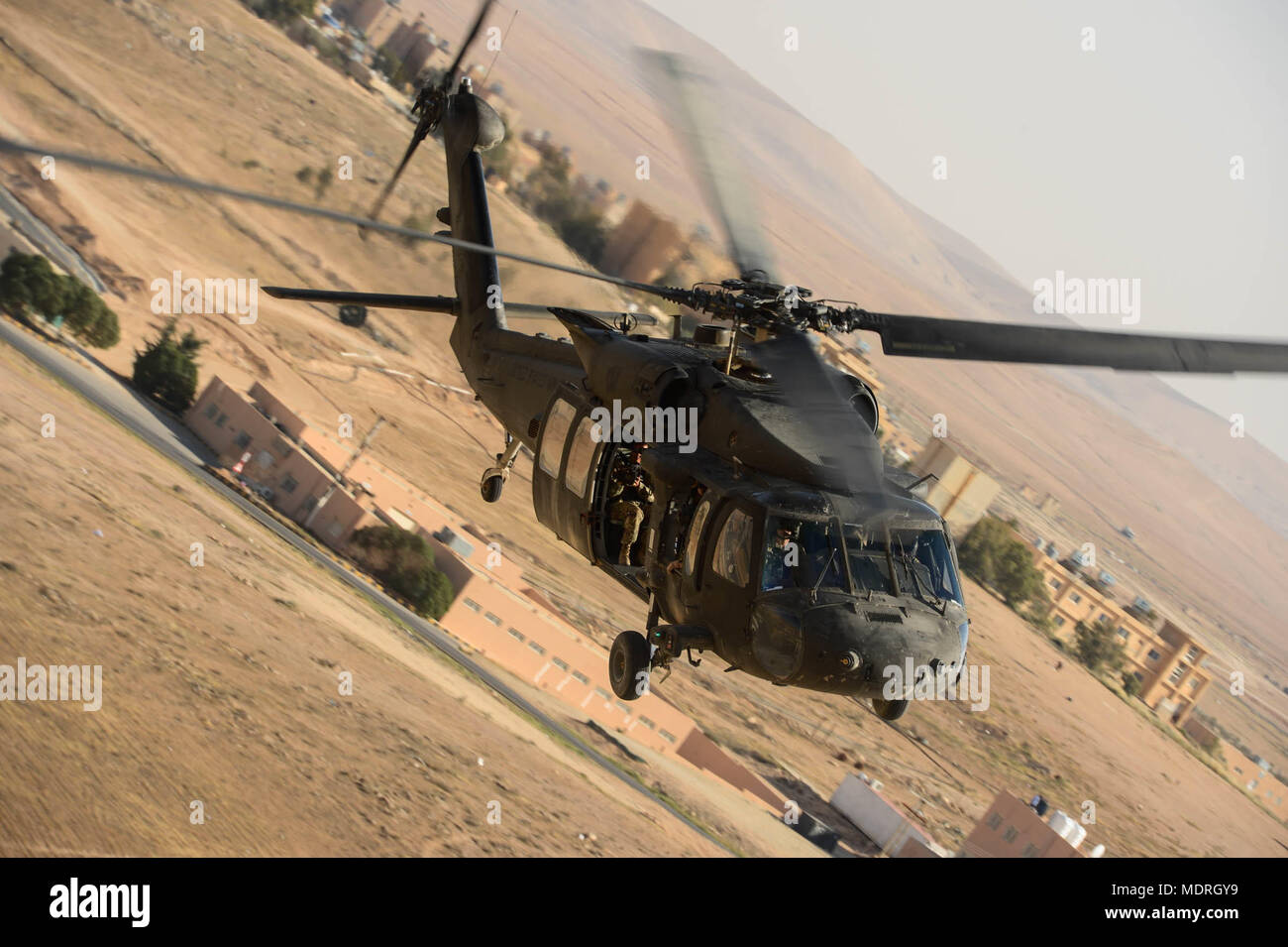 The 1st Battalion, 126th Aviation Regiment, Charlie Company and the 1st Battalion, 244th Aviation Regiment, Assault Helicopter Battalion conduct a medical evacuation validation for Exercise Eager Lion 2018 from King Abdullah II Air Base in Az-Zarqa, Jordan, April 14, 2018. Eager Lion is a major Exercise with the Hashemite Kingdom of Jordan, designed to exchange military expertise and improve interoperability among partner nations. (US Air Force photo by Master Sgt. Joshua L. DeMotts) Stock Photo