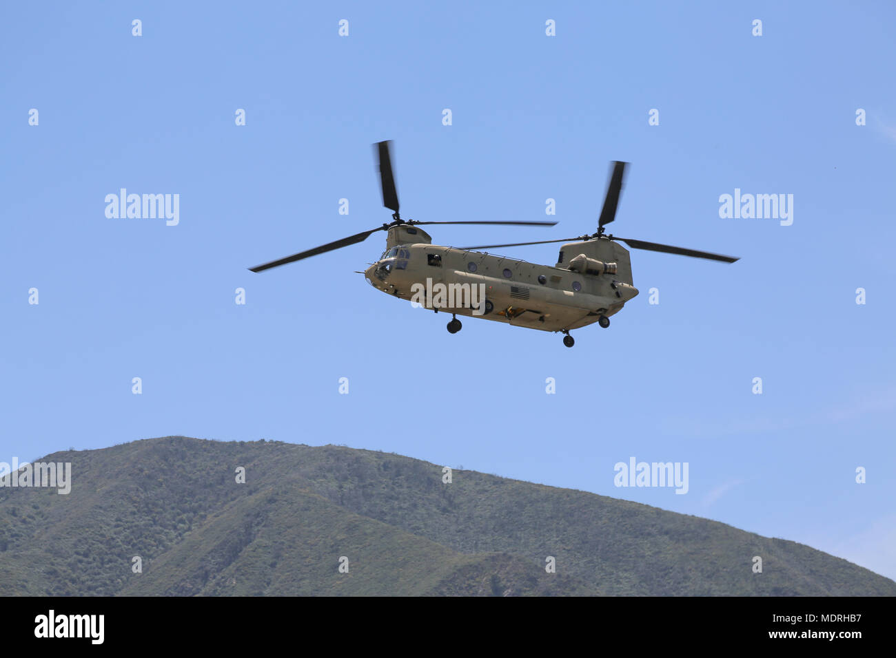 U.S. Army Chinook prepares to land at Big Tujunga Dam Ca., Apr. 18, 2018. The Prominent Hunt 18-1 exercise brings in federal, state, and local agencies to confirm the oncoming 20th CBRNE Ground Collection Team as well as enable other Task Force members to conduct collective and individual training as part of the National Technical Nuclear Forensics (NTNF) Ground Collection Task Force (GCTF). (U.S. Army photo by Pfc. Julie Driver) Stock Photo