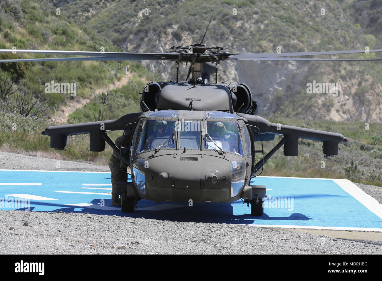 U.S. Army Black Hawk stands by at Big Tujunga Dam Ca., Apr. 18, 2018. The Prominent Hunt 18-1 exercise brings in federal, state, and local agencies to confirm the oncoming 20th CBRNE Ground Collection Team as well as enable other Task Force members to conduct collective and individual training as part of the National Technical Nuclear Forensics (NTNF) Ground Collection Task Force (GCTF). (U.S. Army photo by Pfc. Julie Driver) Stock Photo