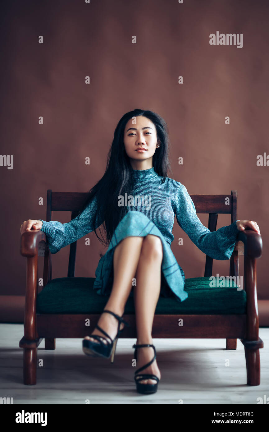 Attractive asian woman crossed legs hi-res stock photography and images -  Alamy