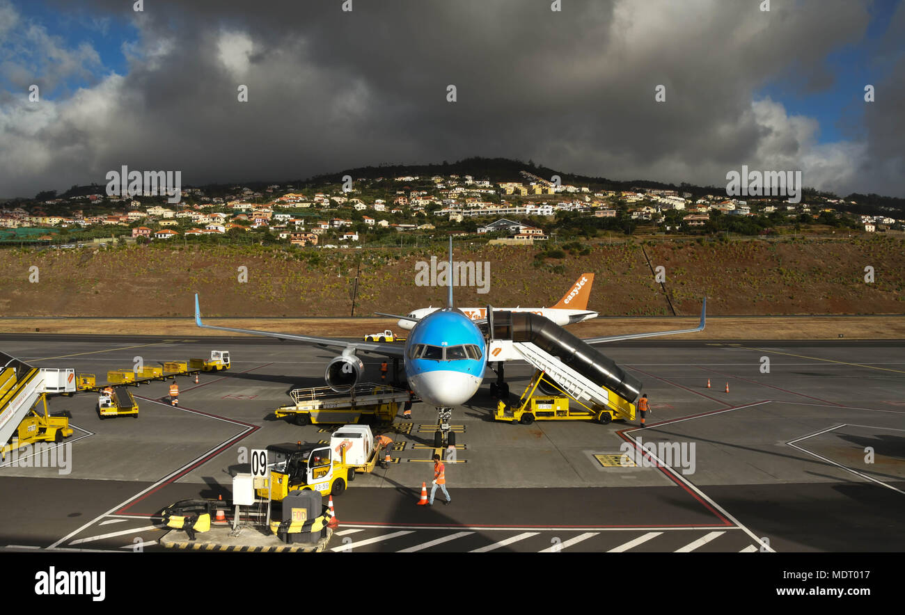 Passenger stairs being attached to a TUI Boeing 757 aircraft on its arrival in Madeira Stock Photo