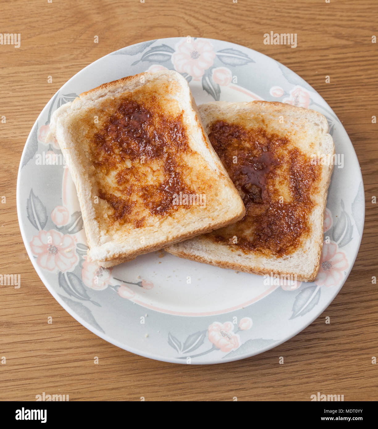 Marmite on toast on a plate Stock Photo Alamy