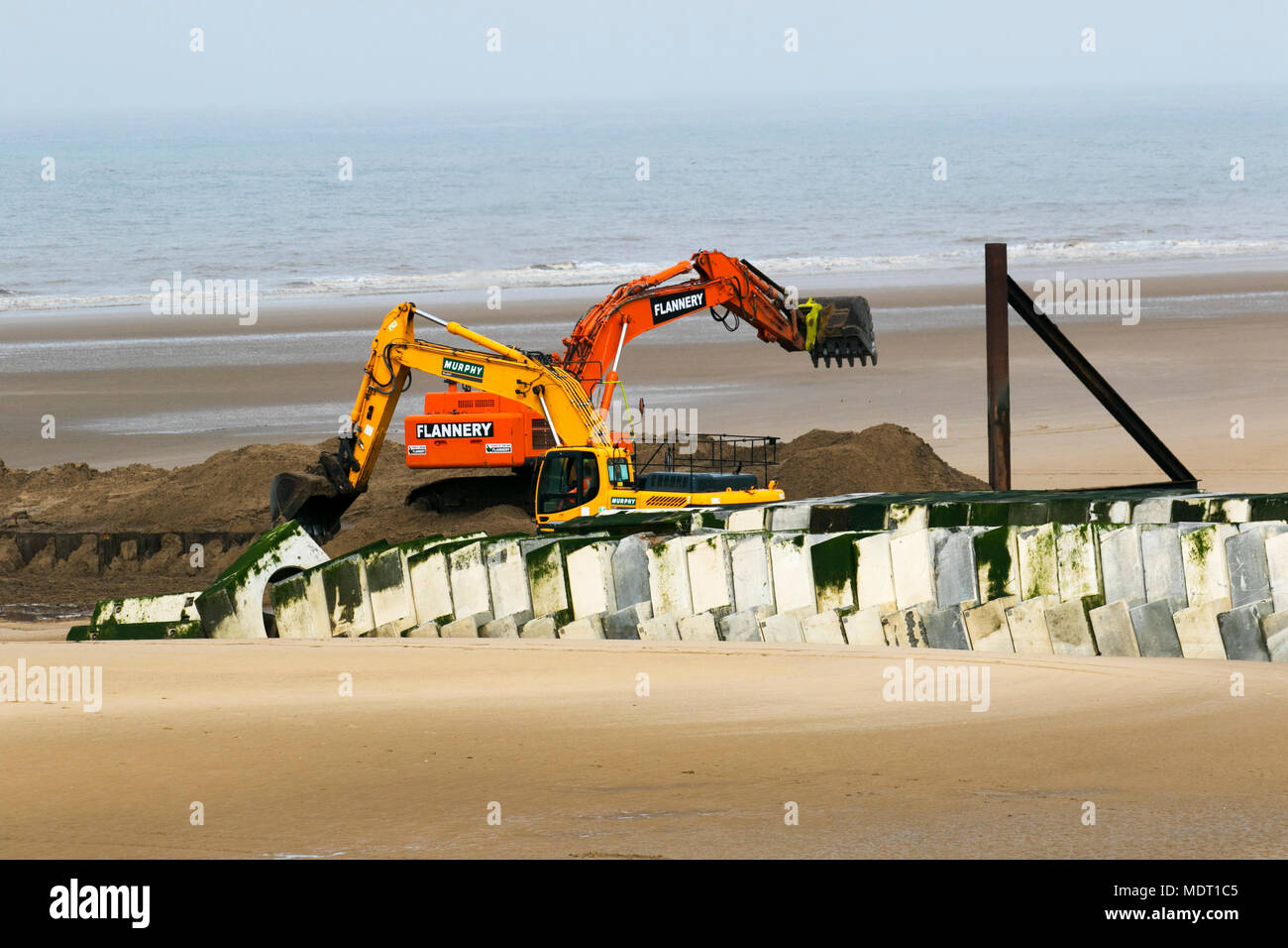 Installation of supersize outfall pipe, the  final installation by water company United Utilities taking yards off the beach and just across the road from the company's on-going project at Anchorsholme Park Stock Photo