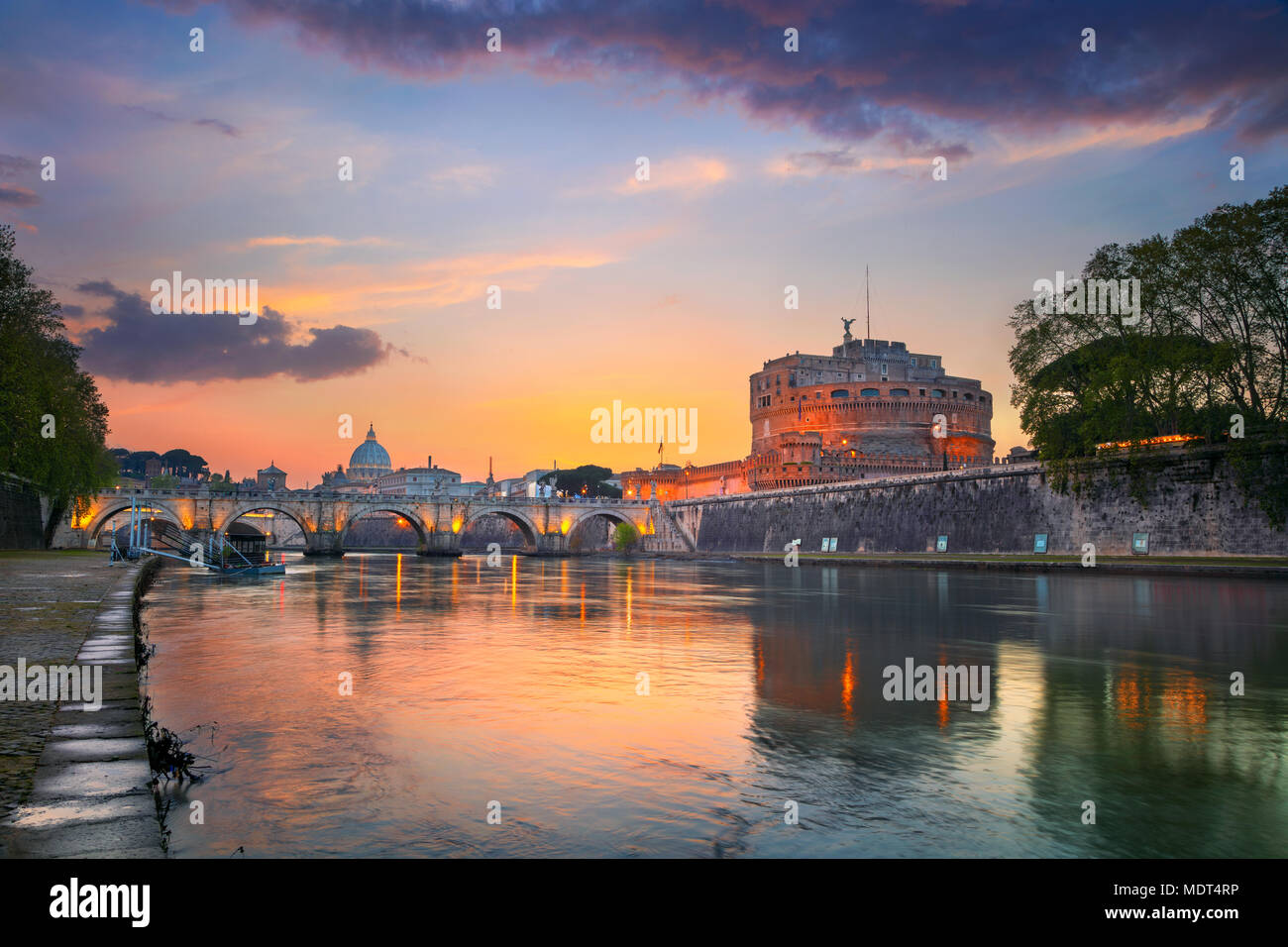 Rome. Image of the Castle of Holy Angel and Holy Angel Bridge over the Tiber River in Rome at sunset. Stock Photo