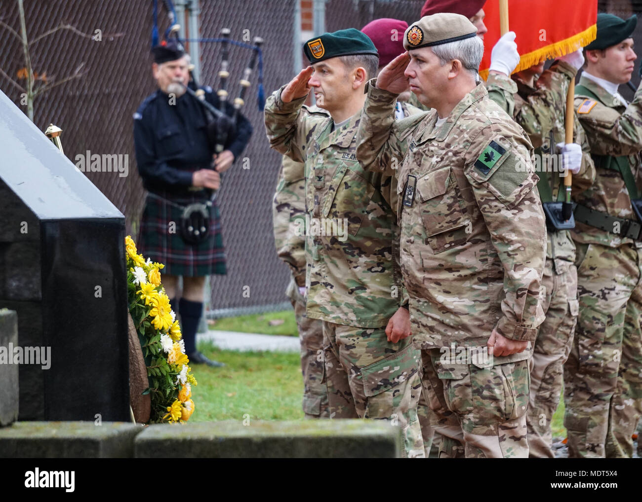 The 1st Special Forces Group Airborne Commander Col Will Beaurpere And Master Warrant Officer Shaun Burdeyny From The Canadian Special Operations Regiment Salute A Wreath That They Laid In Front Of The