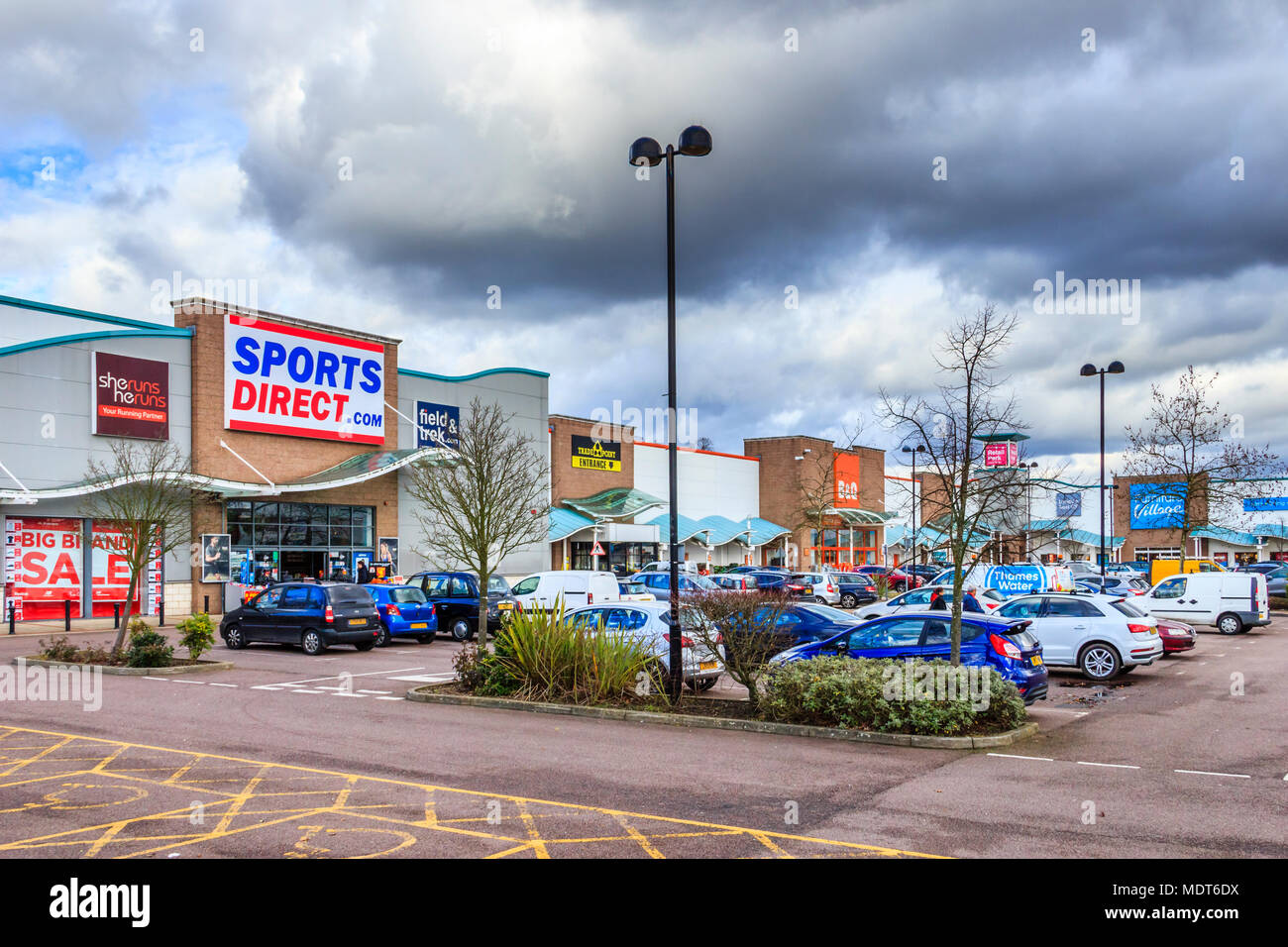 Clouds gather over the Sports Direct store at Friern Bridge retail park, next to the North Circular Road near Friern Barnet in North London, UK Stock Photo
