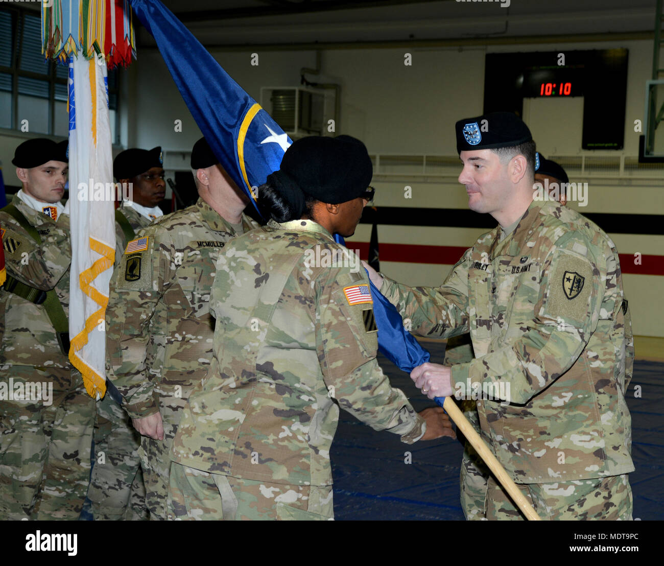 Col. Jason G. Riley, Commander, USANATO Bde., passes the colors to ...