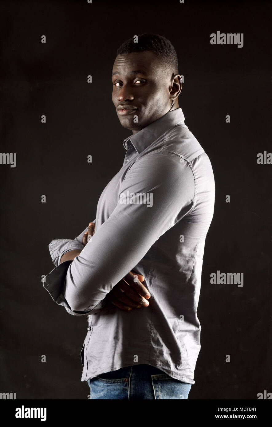 portrait of a african man arms crossed Stock Photo - Alamy