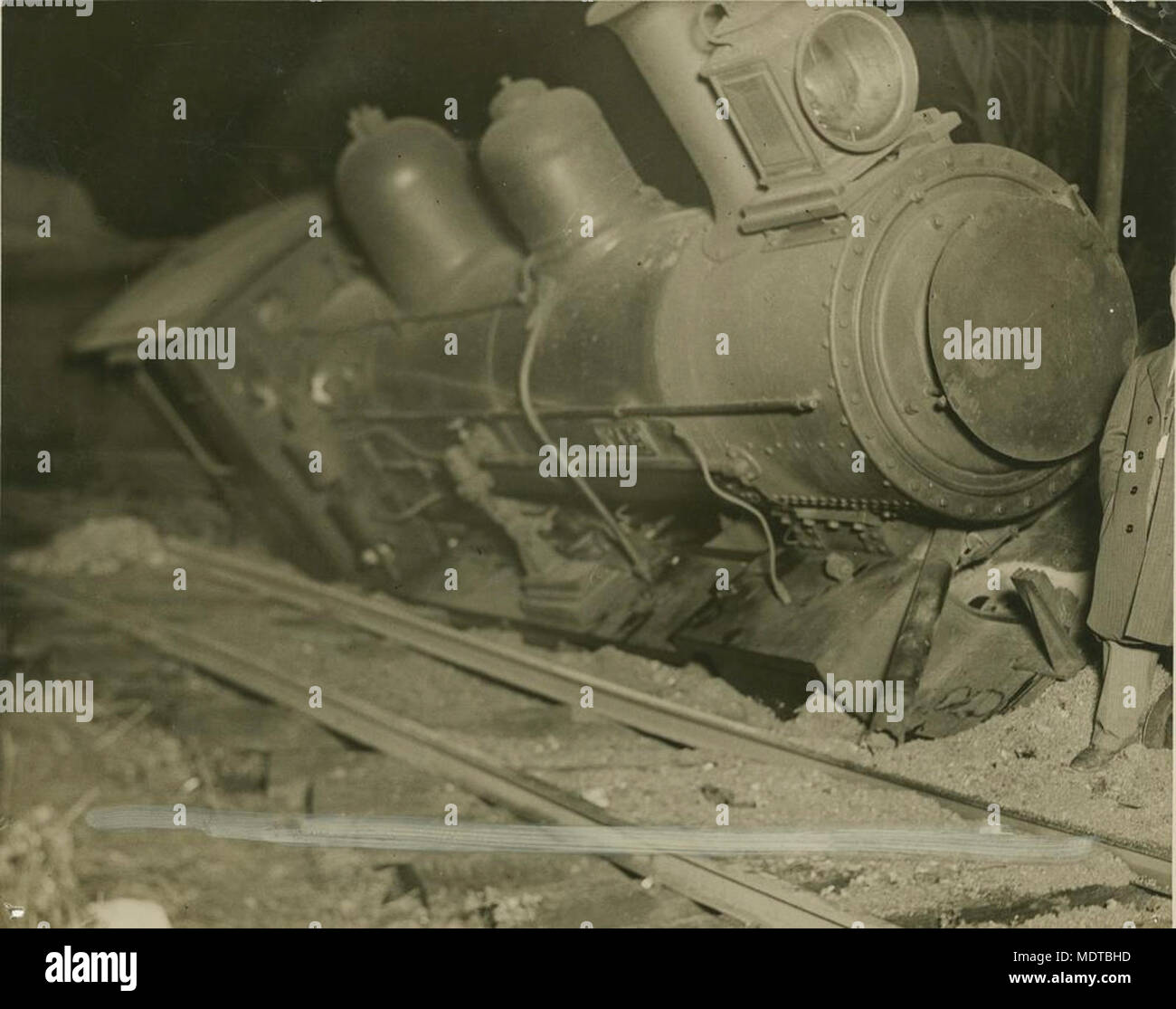 Locomotive derailment on the Gold Coast. Location:  Queensland, Australia  Date: Undated  Description: Possibly in the 1930s. Stock Photo